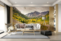 Cozy bedroom with autumn lake wall mural, neutral bedding, calm scenic view