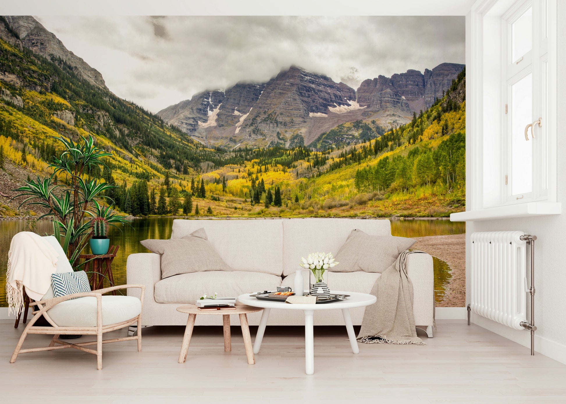 Mountain lake in fall colors wallpaper behind sofa, modern apartment wall decor