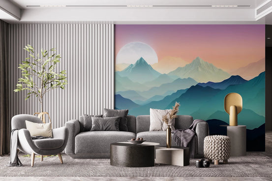 Mountain Serenity wallpaper mural of teal peaks and a rising moon behind a grey sectional and fluted wall in a living room