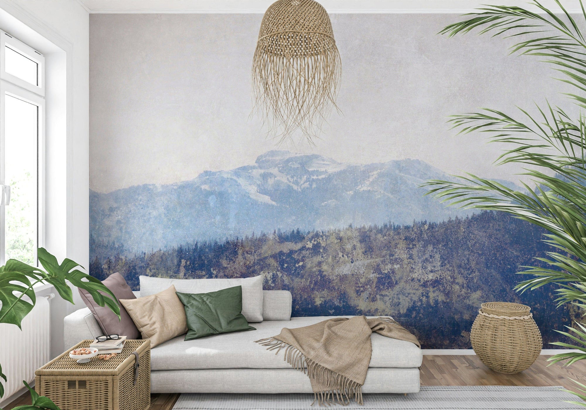 Mountain Vista Texture wallpaper mural of faded blue mountains behind a white daybed sofa and woven pendant in a living room