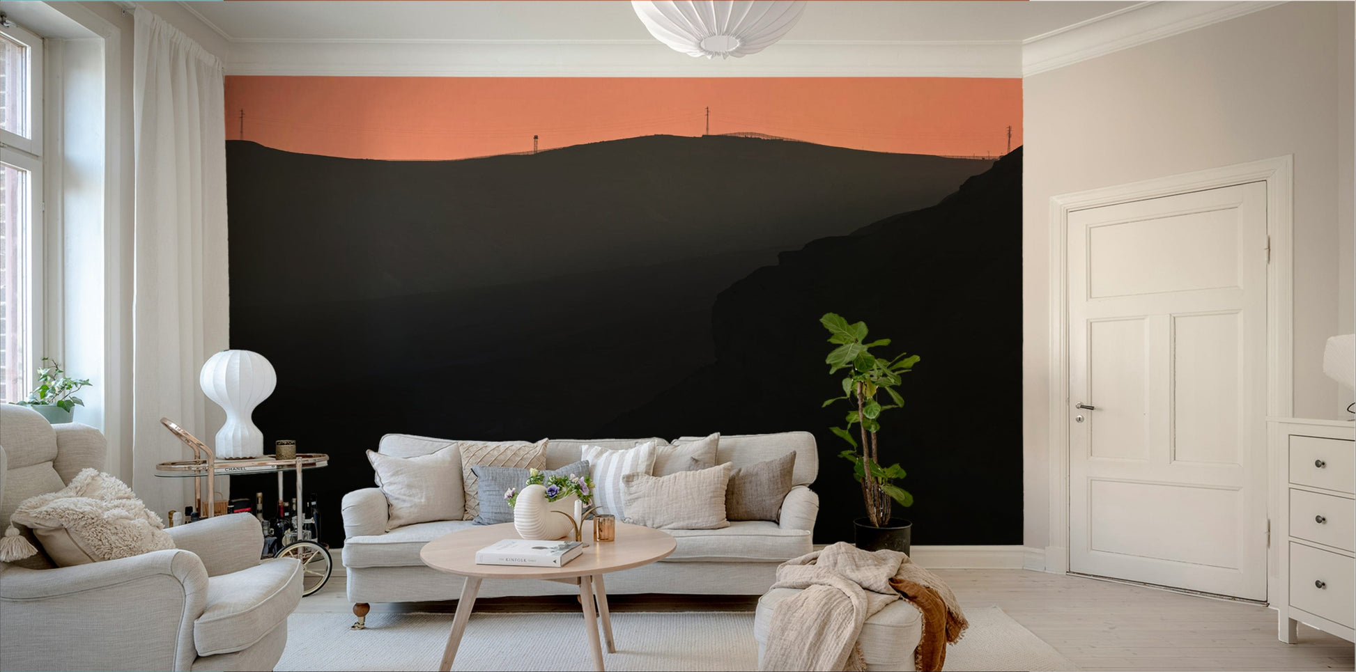 The wallpaper is used as a feature wall in a bedroom.

