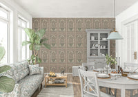Large scale floral wall mural behind a beige sofa