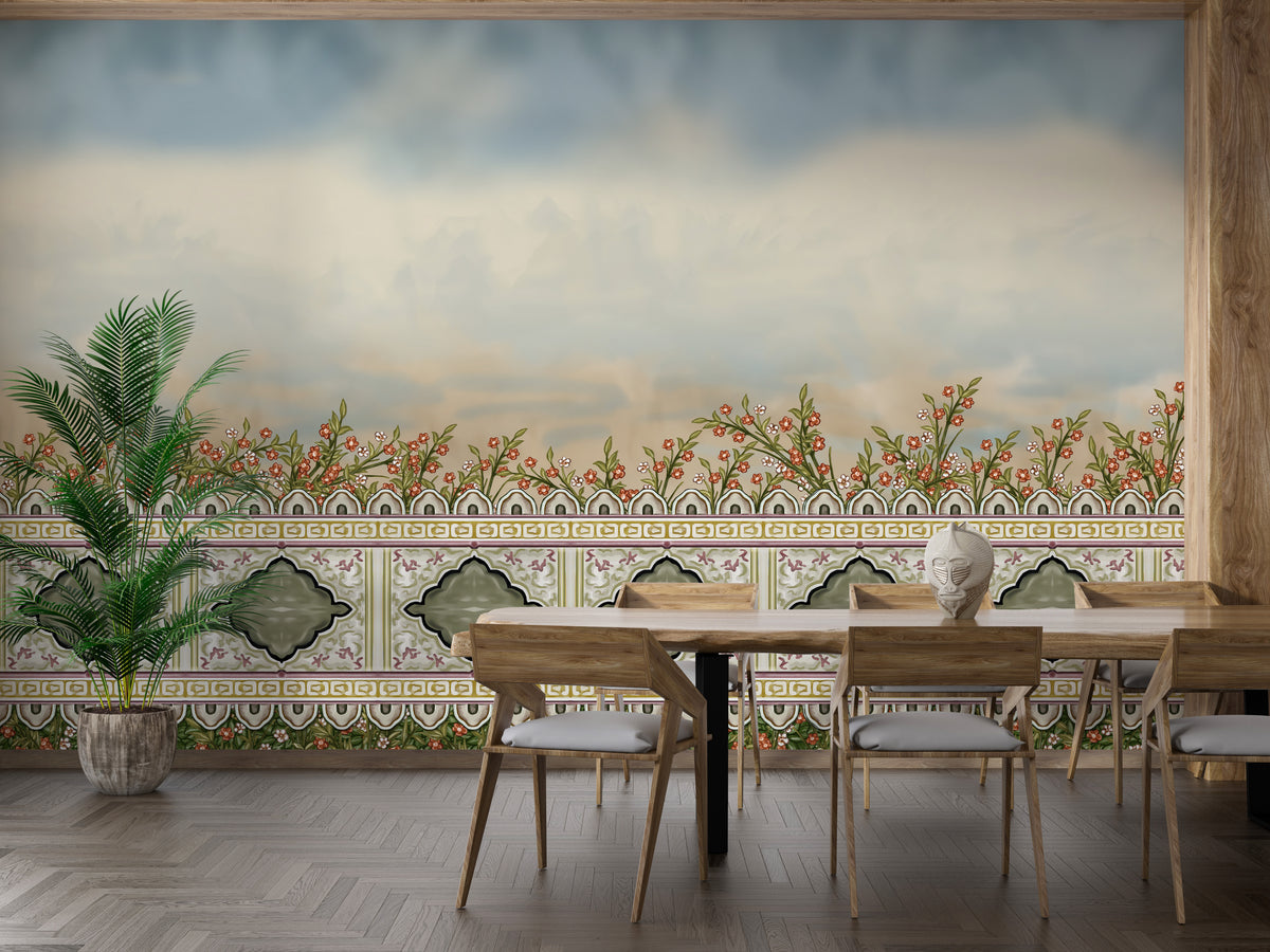 Mughal Garden Fence wallpaper mural with red floral border and green tilework above a wooden dining table and chairs with a palm