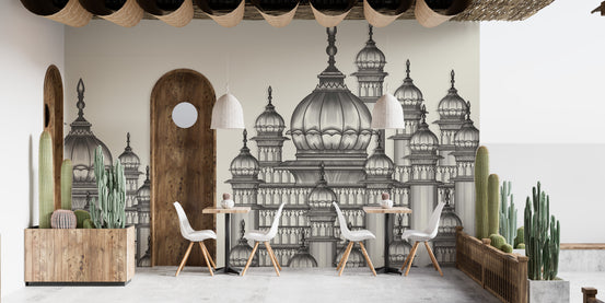 Mughal Palace wallpaper mural in grey domes behind white chairs and cactus planters in a bright cafe