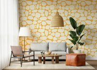 Natural Pebble Pattern wallpaper for walls, irregular shapes, sunny neutral color palette.