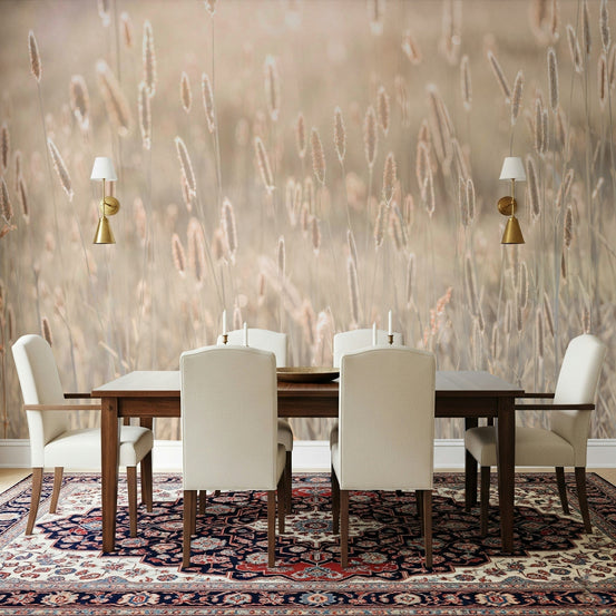 Nature's Bliss wallpaper mural of soft beige grasses behind a dark wood dining table and cream chairs in a dining room