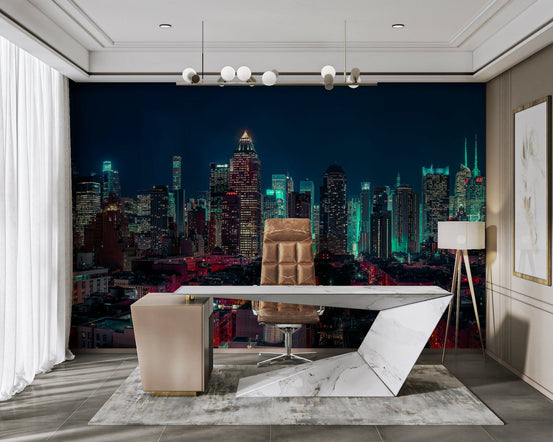 Neon City Nights wallpaper mural of a teal and red night skyline behind a marble desk in a home office