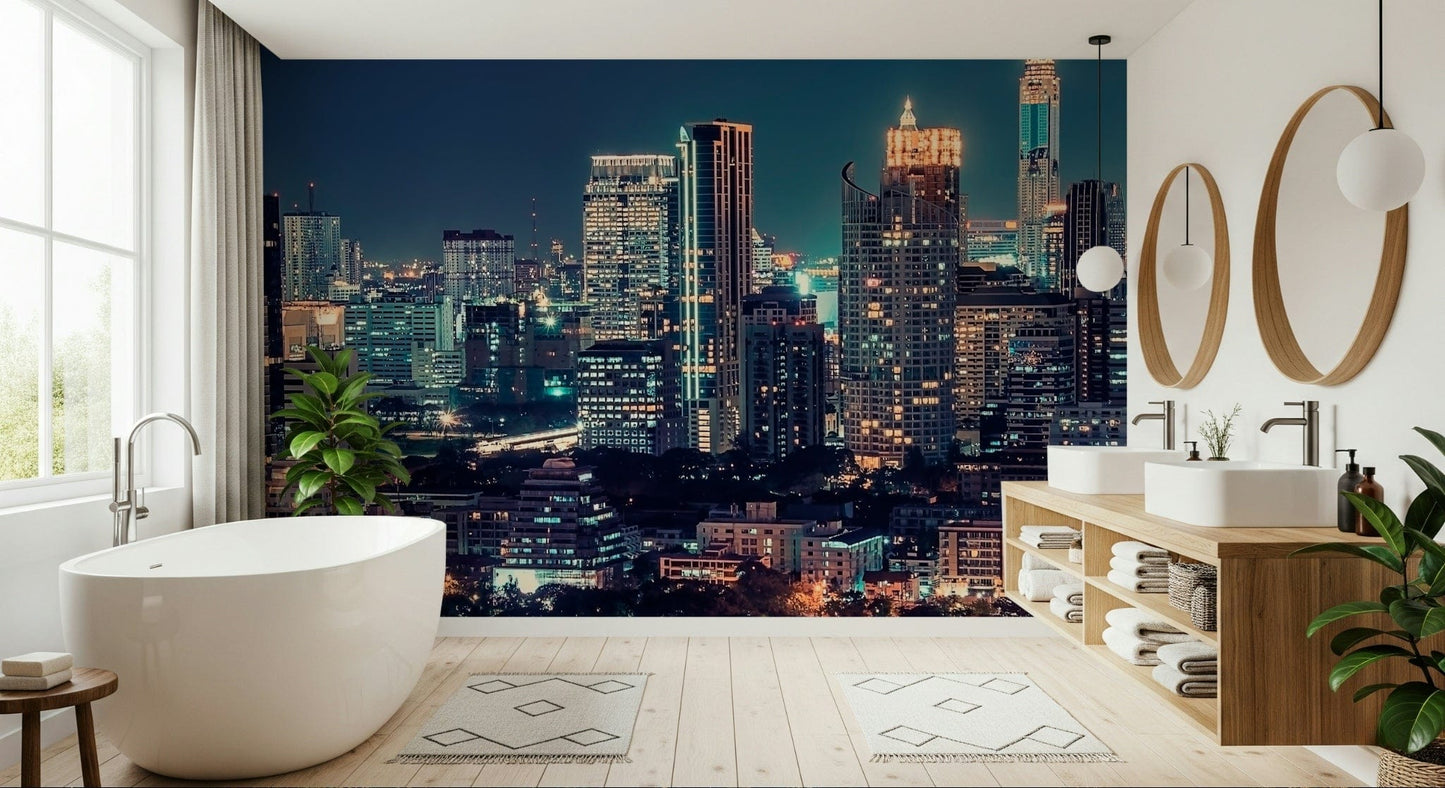 Night cityscape wallpaper behind sofa, deep colour tones and warm light details
