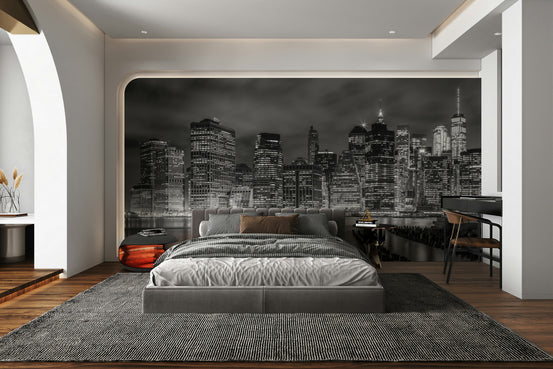 NEW YORK CITY Monochrome Night Impressions wallpaper mural of a black-and-white skyline behind a gray bed in a bedroom
