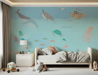 Playroom feature wall mural with ocean animals, soft color gradients, bright and tidy room setup