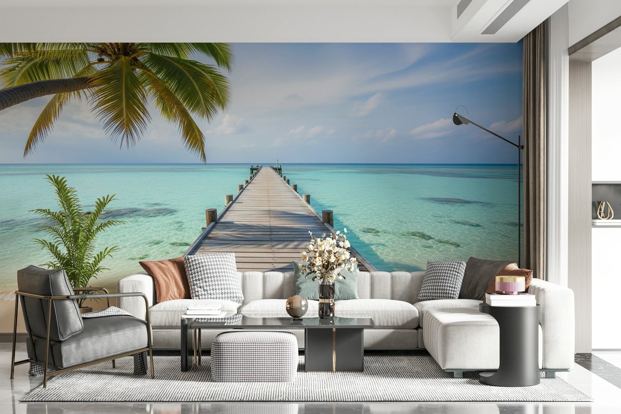Ocean Pier Dream wallpaper mural of a wooden pier over turquoise sea behind a white sectional in a living room