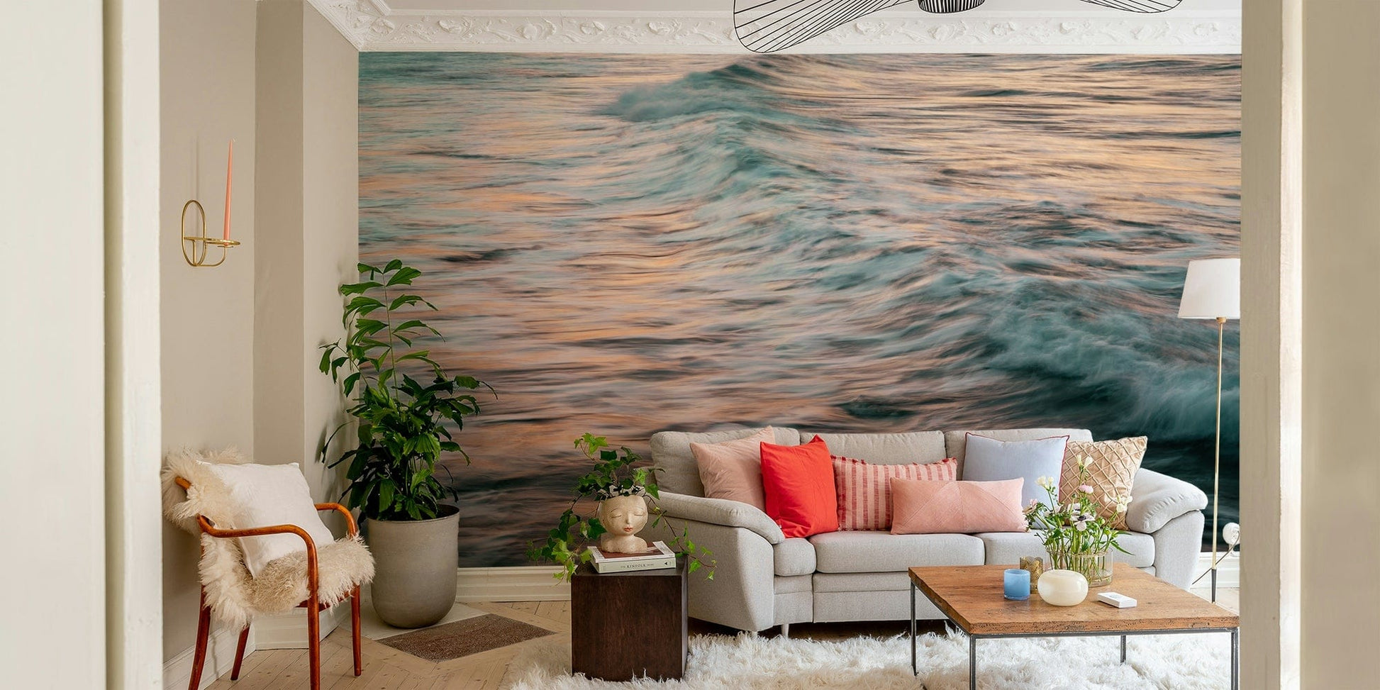 A contemporary living room with a large ocean wave wall mural.


