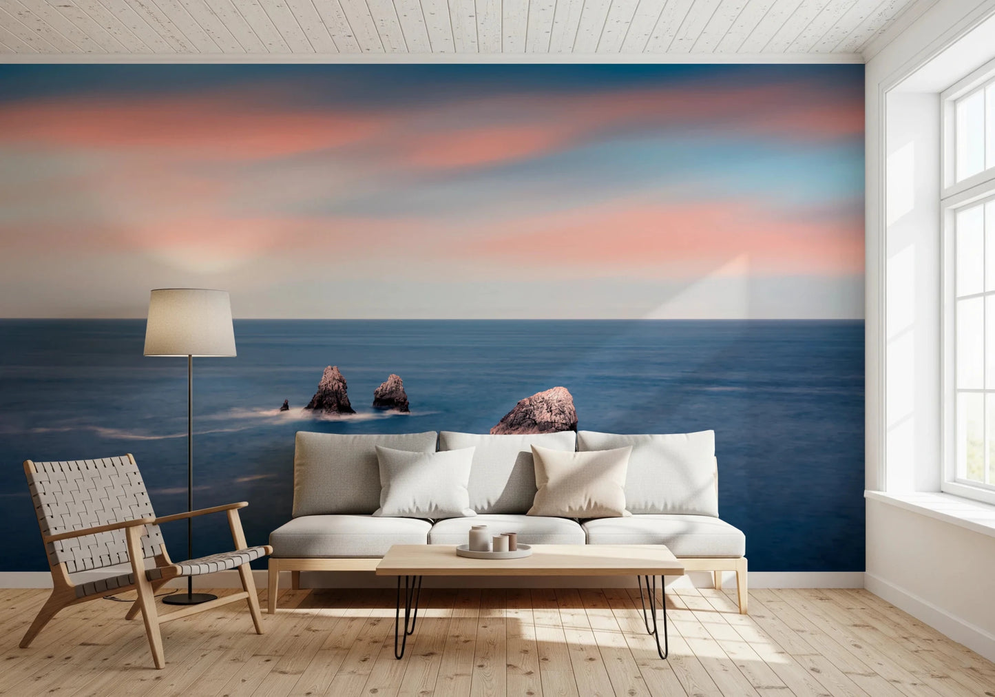 Coastal wall mural behind neutral living sofa