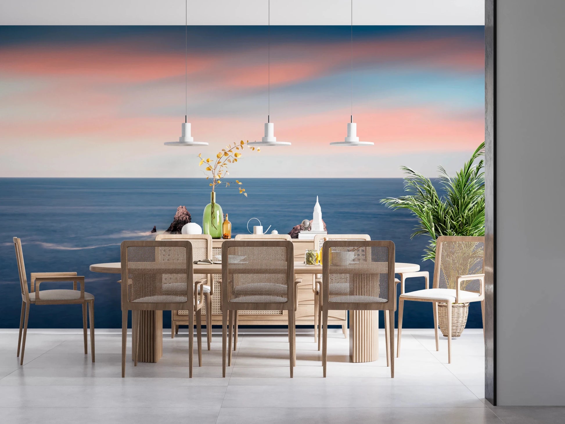 Sunset ocean wall mural above modern dining set