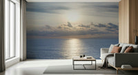 Dining room feature wall mural with ocean glow, neutral furniture and warm color