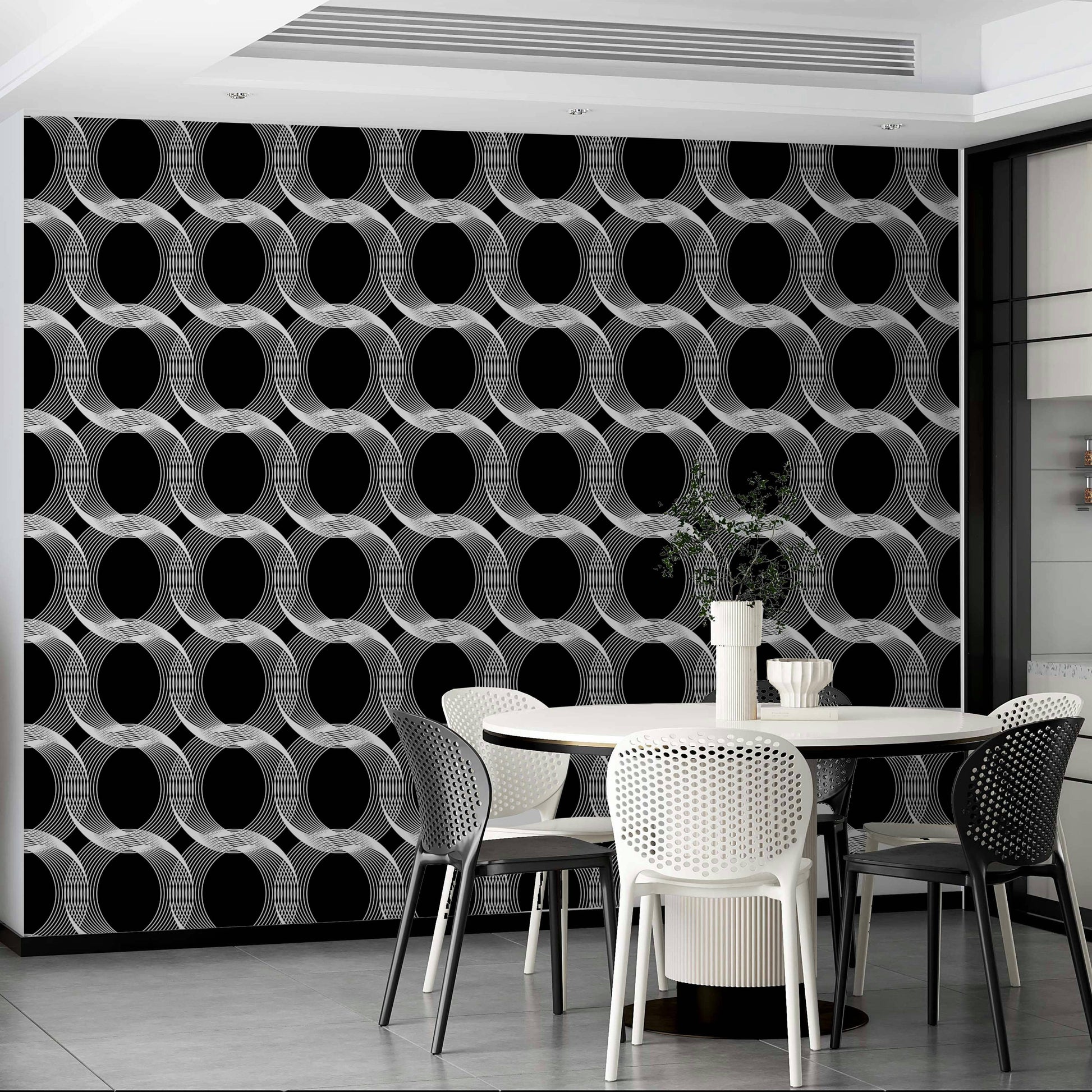 Wallpaper with a black and white repeating circles design

