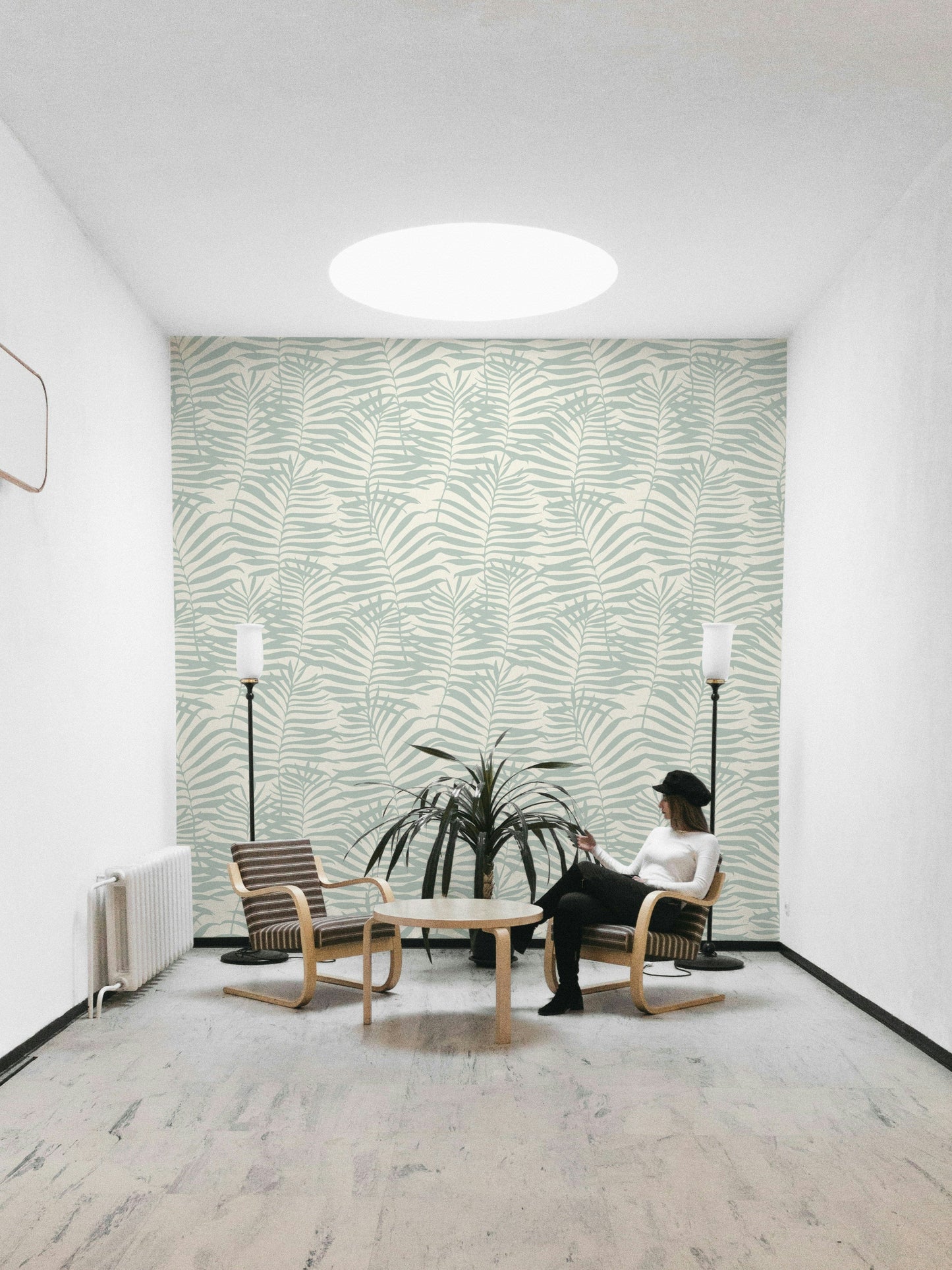 The design is a repeating pattern of large palm leaf silhouettes.
