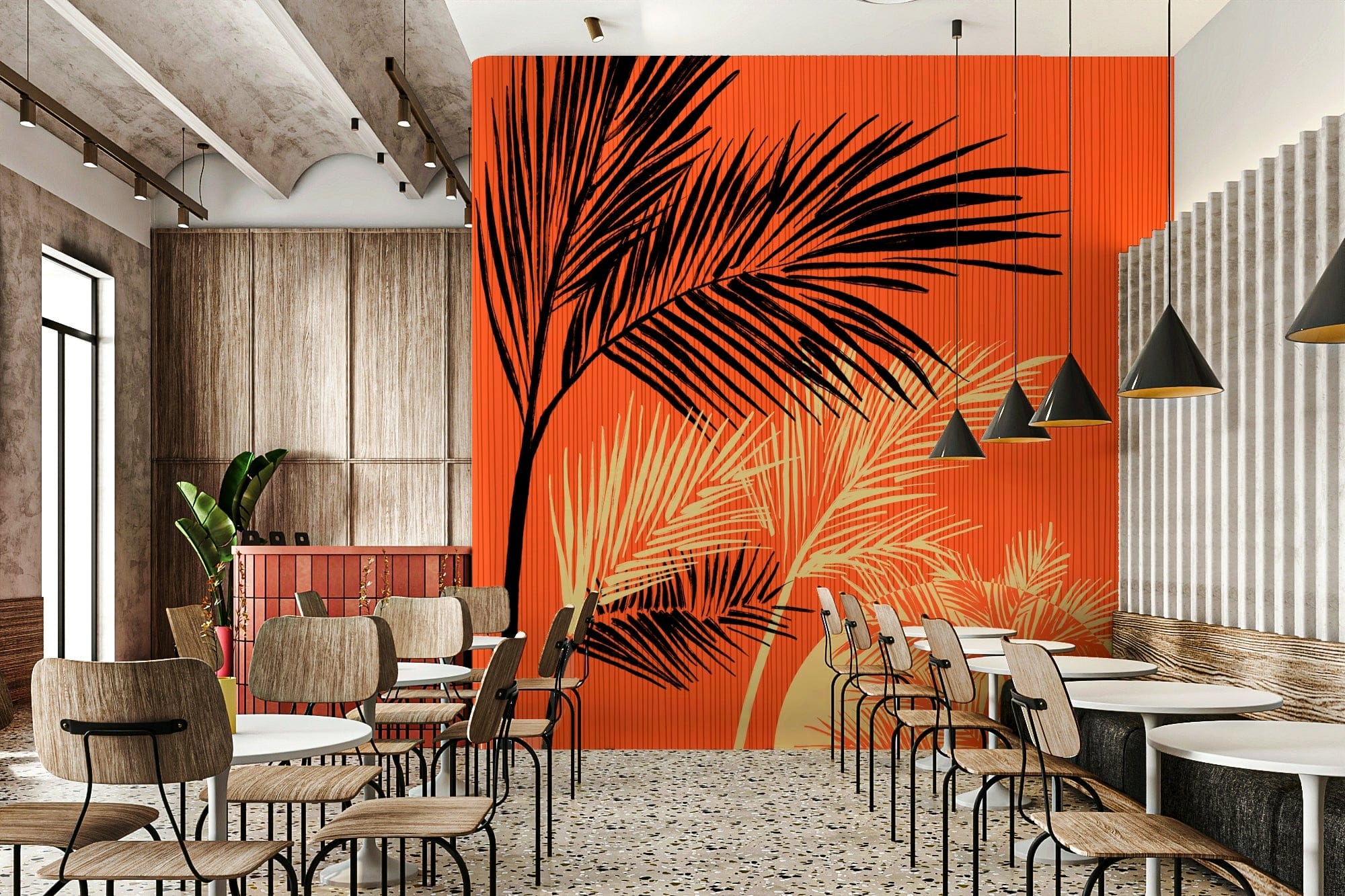 Palms at Sunset wallpaper mural with black palm fronds on orange in a cafe with wood bistro chairs