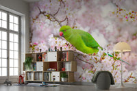 Wallpaper mural of a green parrot among blooming cherry trees.

