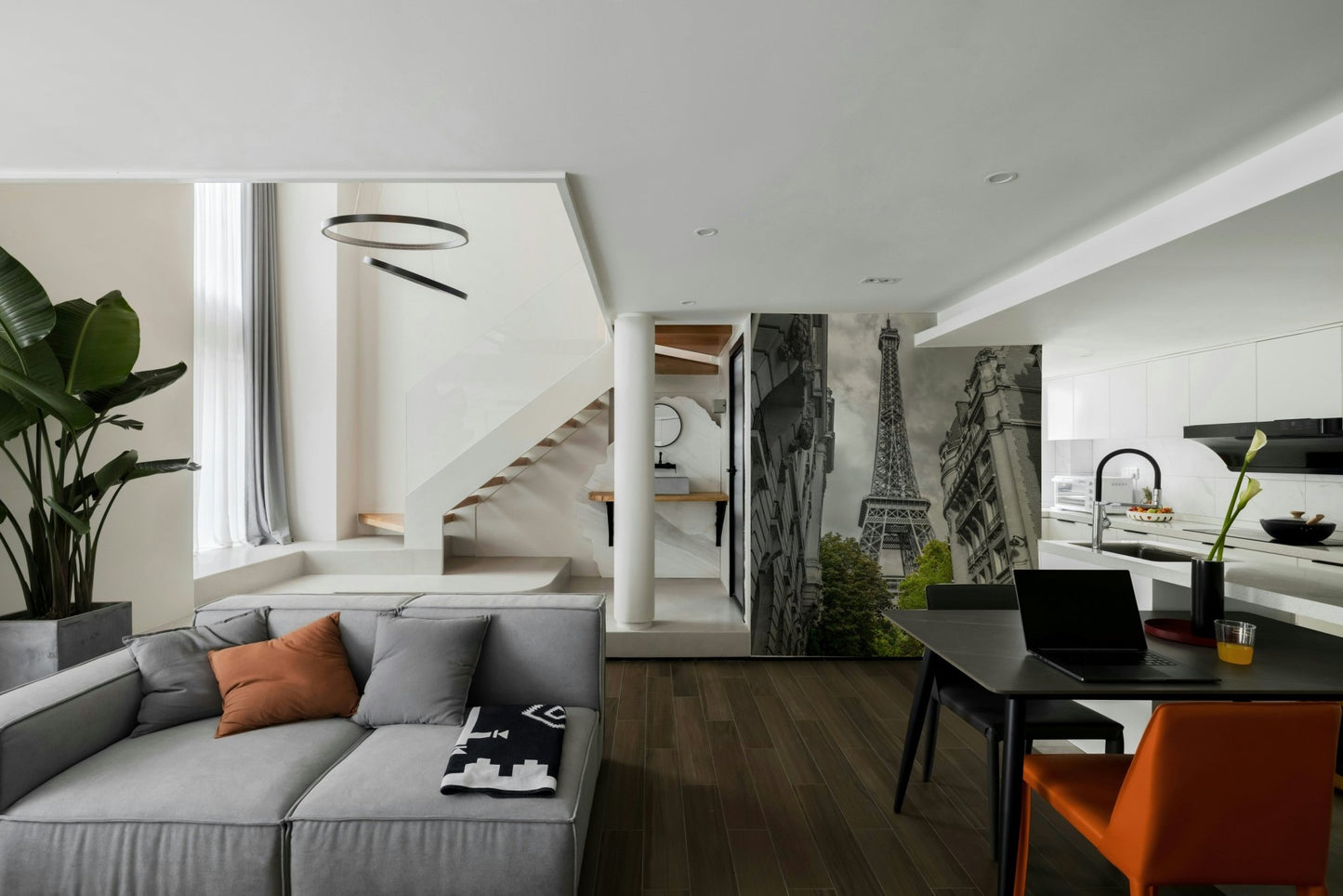 The image shows a full wall with the Eiffel Tower viewed from a street.

