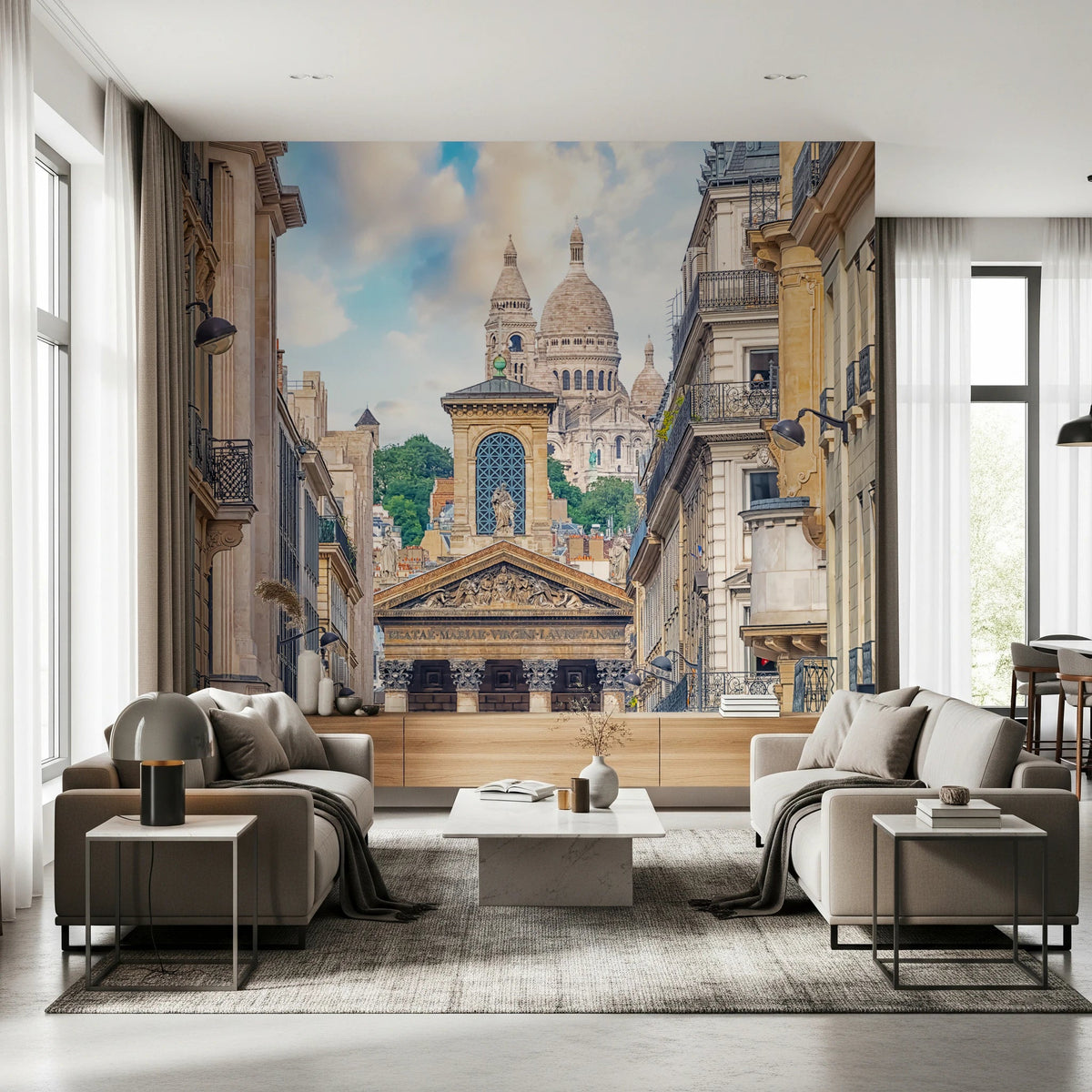 Parisian View wallpaper mural of Sacre-Coeur down a Haussmann street behind beige armchairs in a living room