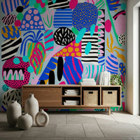 Colorful abstract shapes layered with stripes and dots create a fun, upbeat party wallpaper look.