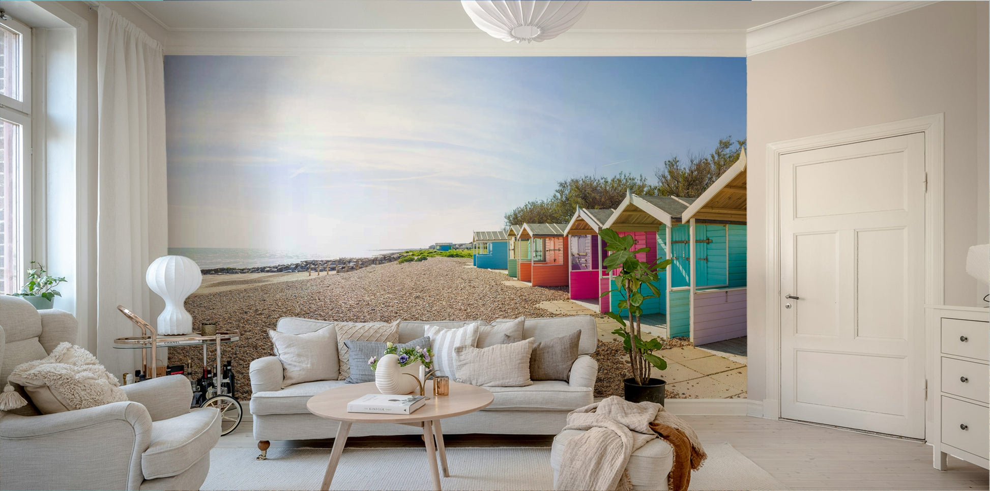 A beautiful coastal cabin wallpaper mural on a sandy beach.

