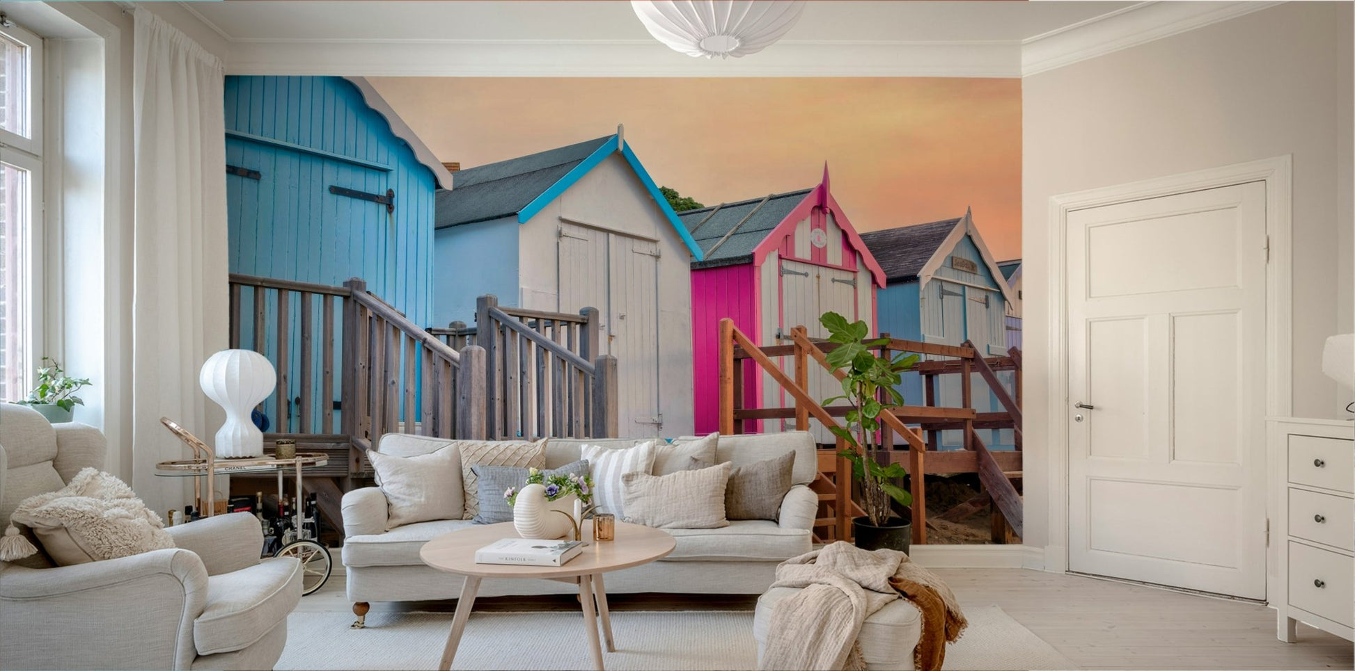The image shows a repeating pattern of small beach huts.

