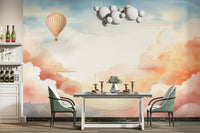 Home office with a large scale ethereal cloud mural installation and sleek desk.