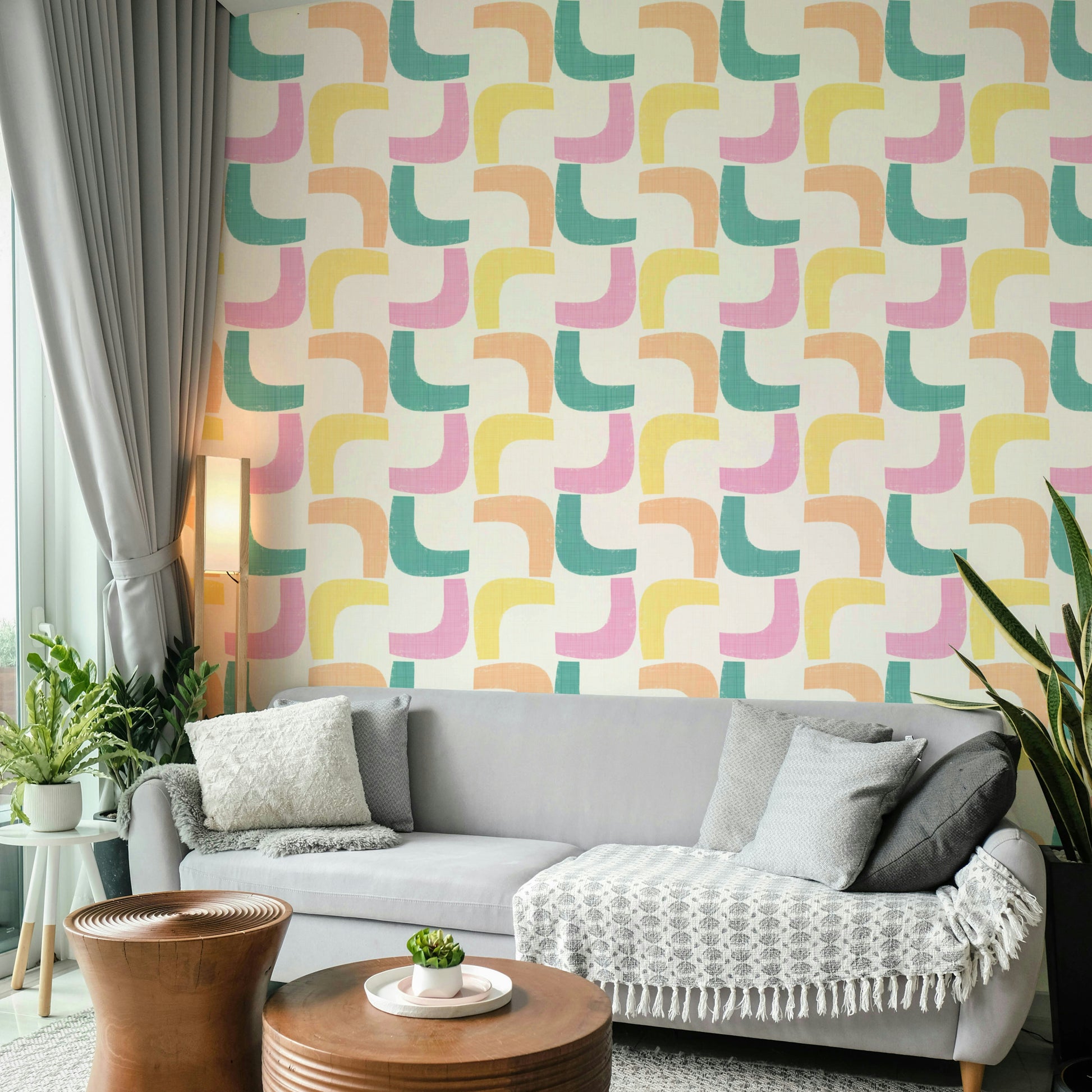 Soft pastel retro wallpaper featuring boomerang shapes and dynamic lines.

