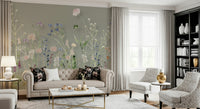 A botanical wallpaper with delicate wildflowers painted in pastel tones against a calm sage backdrop.