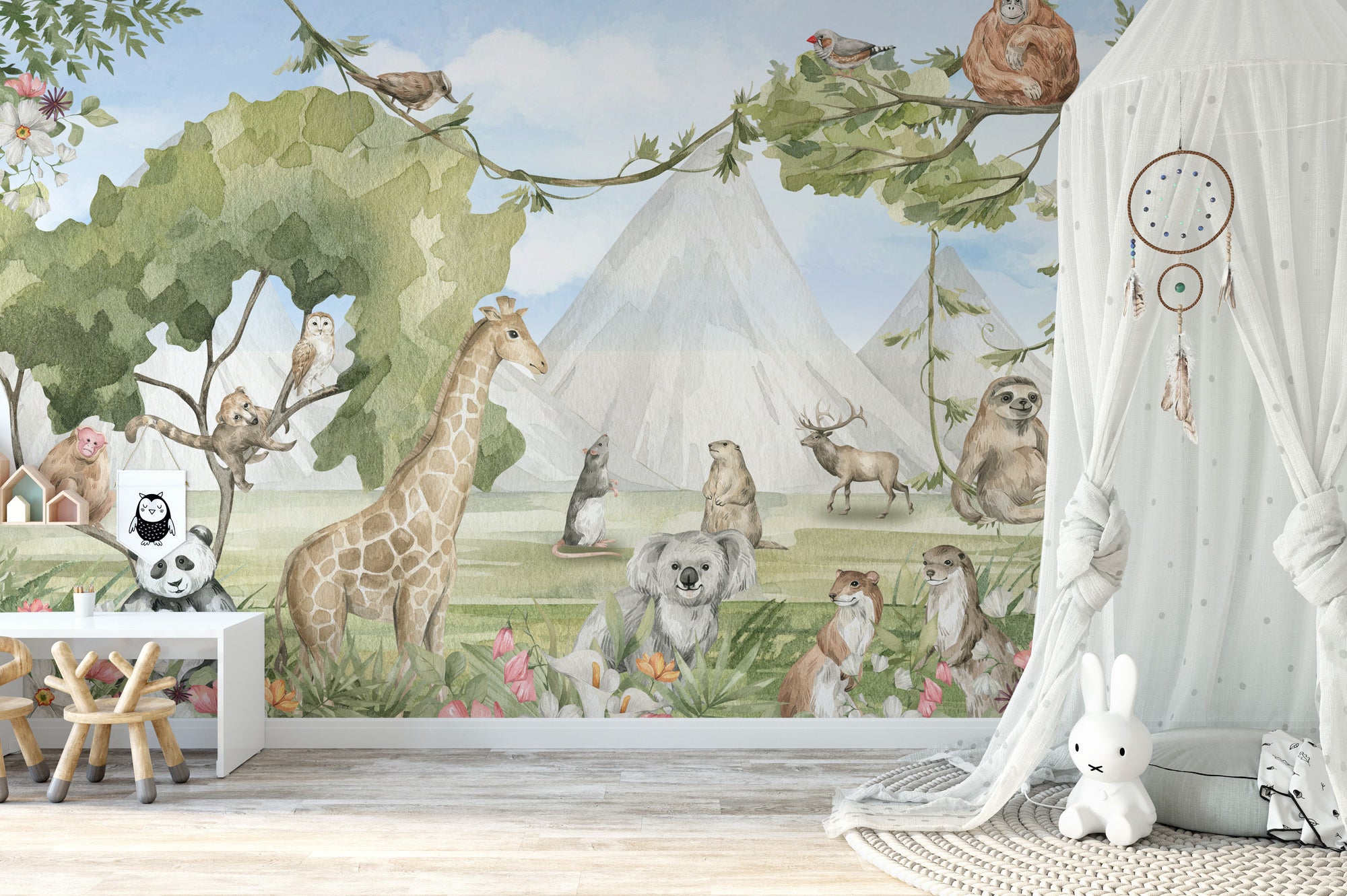 Pastoral Paradise wallpaper mural with watercolor giraffe, koala and sloth among mountains in a soft nursery