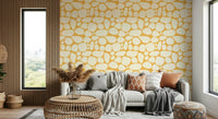 Bold yellow wallpaper with pebble forms