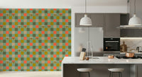Checkerboard wallpaper with vintage-style eyes peeking from multicolored mustard, coral, olive, cream, and mint green blocks.