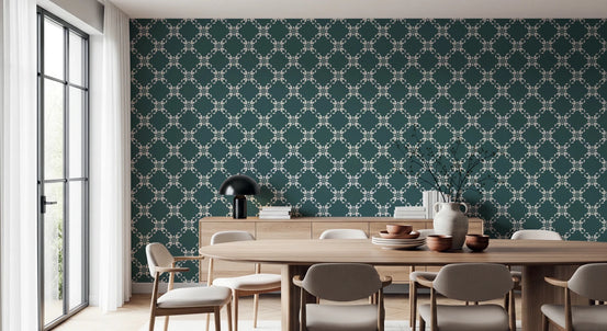 Petal Lattice wallpaper in teal and cream in a dining room with an oval wood table, beige chairs and wood sideboard