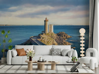 Seaside lighthouse mural above console table in entryway, muted colors