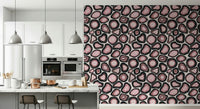 Organic agate shapes in soft pink tones forming a gemstone-inspired wallpaper design.