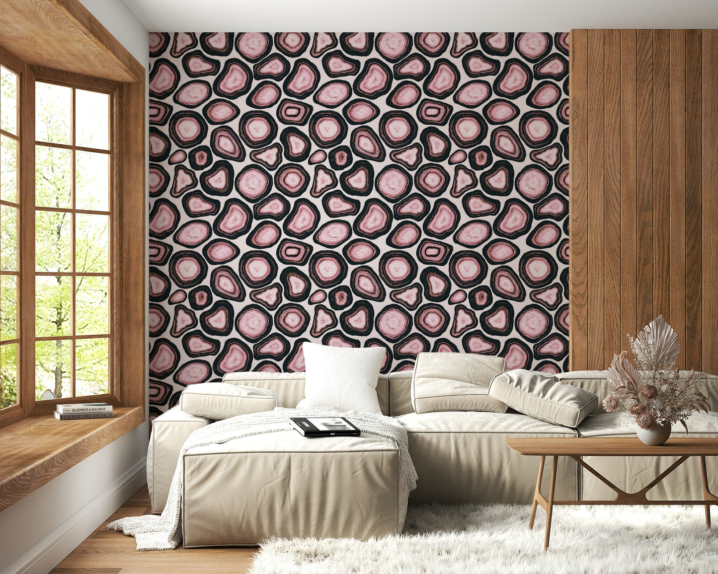 A patterned wallpaper with repeating pink geode shapes for a luxurious stone aesthetic.