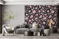 A seamless wallpaper with pink geode-style formations outlined in bold dark rings.