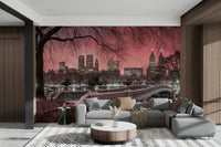 Cozy reading nook with a pink dusk mural.