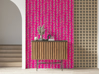 Colorful leaf designs arranged along upward vine stripes against a vivid fuchsia wallpaper background.