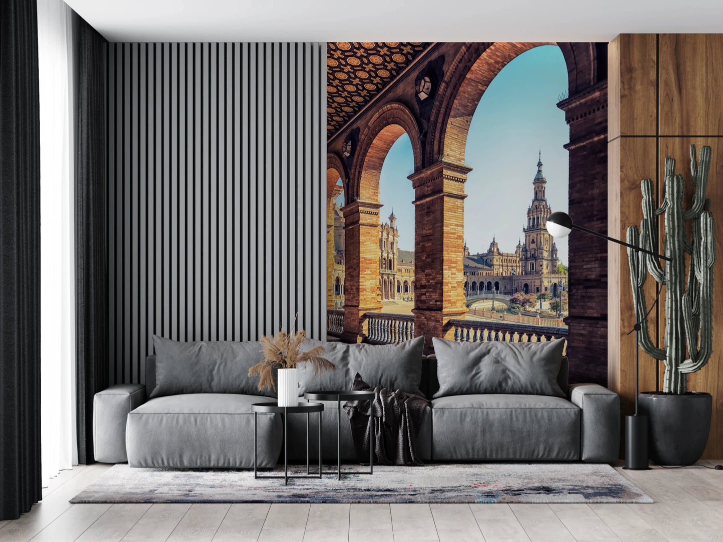 Plaza de España View wallpaper mural of the sunlit plaza arches above a grey sofa by a slatted wall and cactus