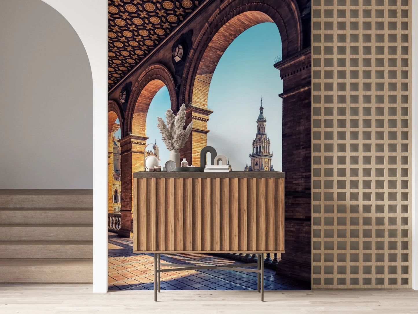 Plaza de España View wallpaper mural of the plaza through brick arches above a fluted wood console in a hallway