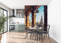 Plaza de España View wallpaper mural of the Seville plaza tower behind a round dining table and black bentwood chairs