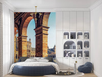 Plaza de España View wallpaper mural of Seville arches and plaza behind a round blue bed in a child's bedroom