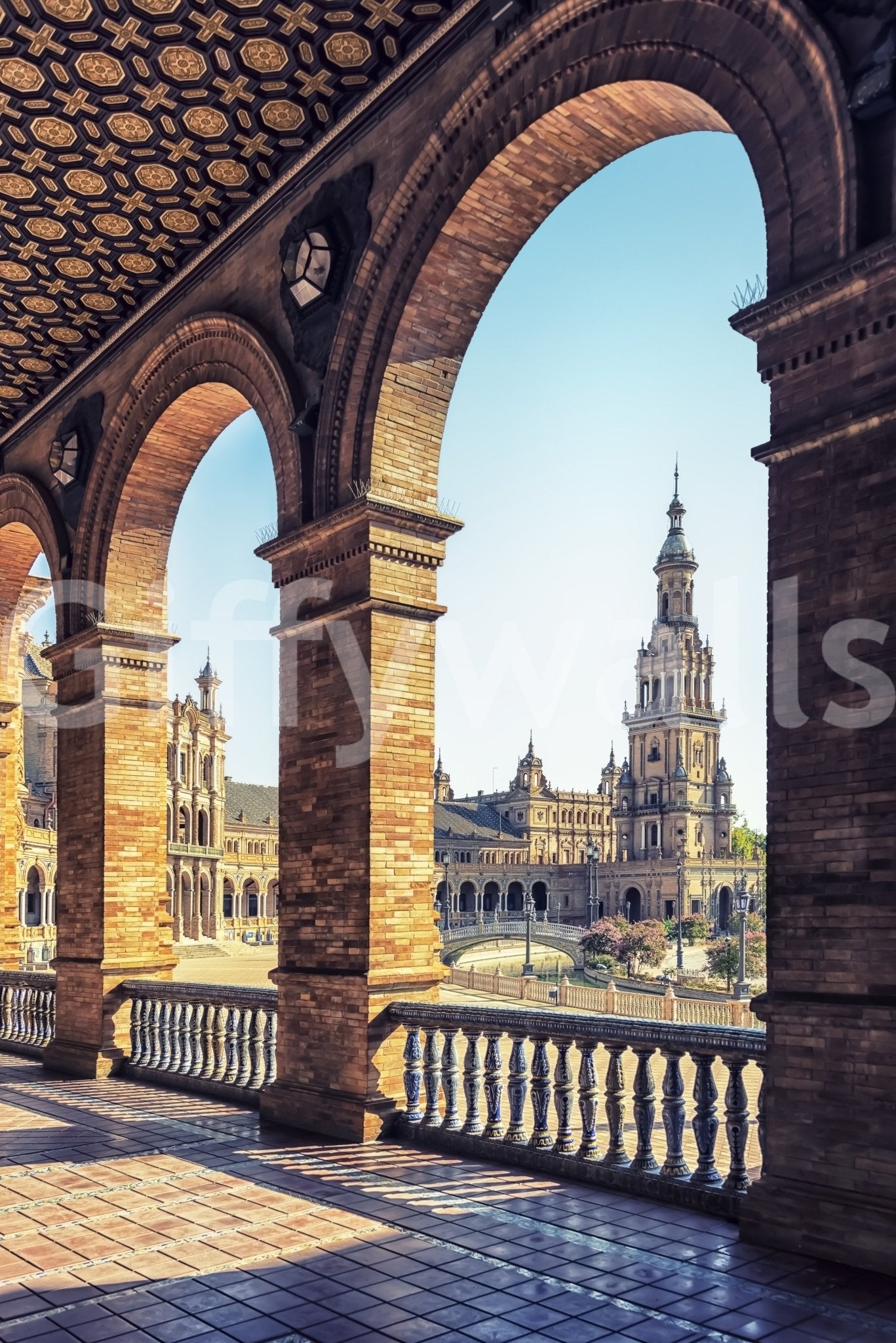 Plaza de España View wallpaper mural shown as a close-up of the brick arched colonnade framing the Seville tower