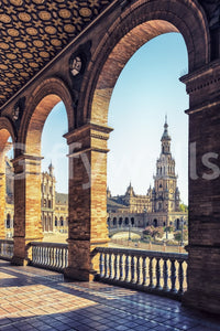 Plaza de España View wallpaper mural shown as a close-up of the brick arched colonnade framing the Seville tower