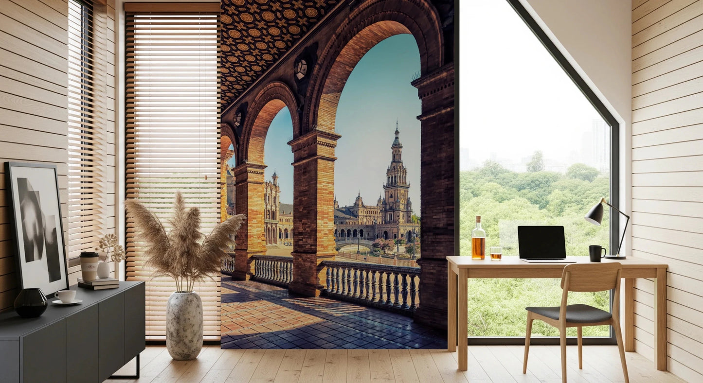 Plaza de España View wallpaper mural of the arched balcony and tower beside a wood desk in a sunlit home office
