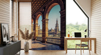 Plaza de España View wallpaper mural of the arched balcony and tower beside a wood desk in a sunlit home office