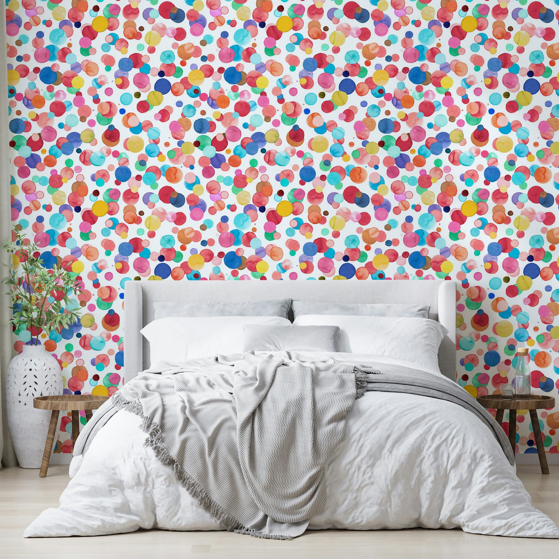 Cheerful polka dot mural in coral, teal, blush, and mustard tones.

